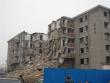 Buildings under demolition for a new highway next to the hostel