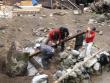 Kevin and Jeremy helping the locals to move a rock