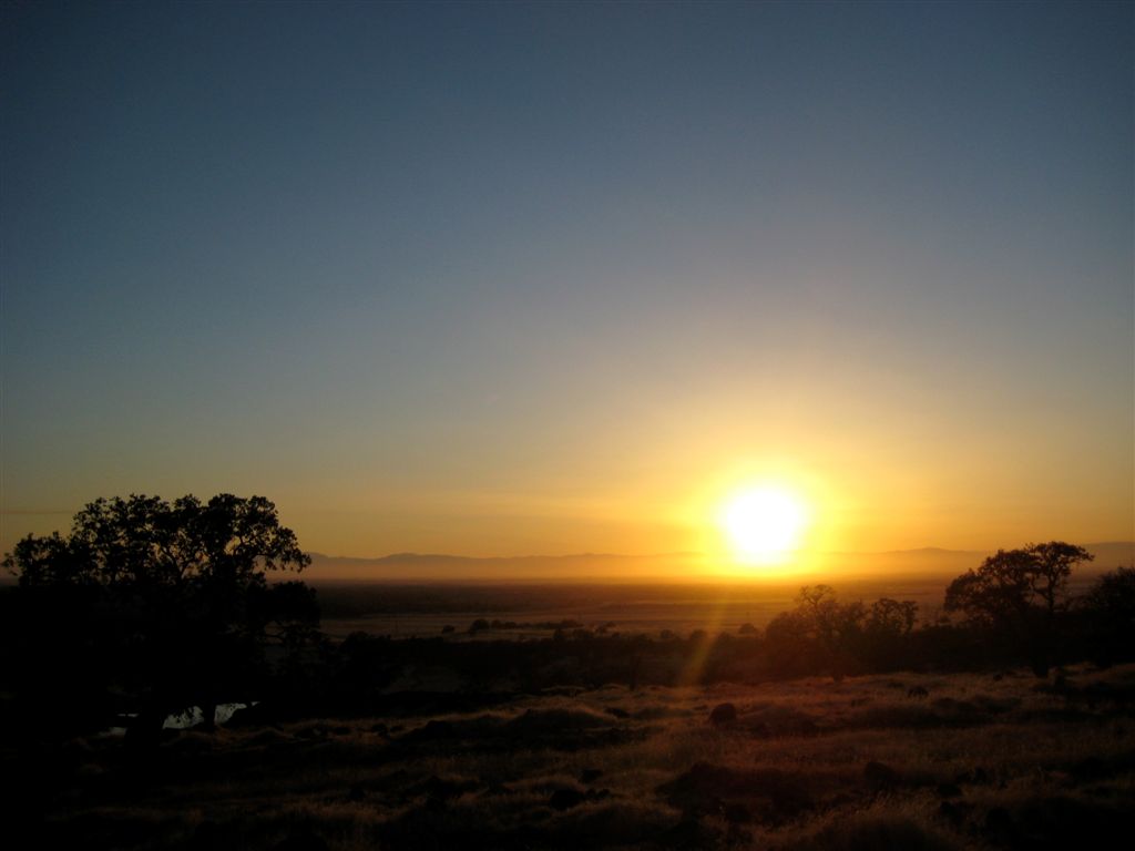 Setting behind the distant coastal mountains