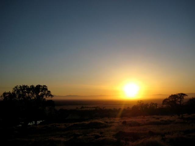 Setting behind the distant coastal mountains