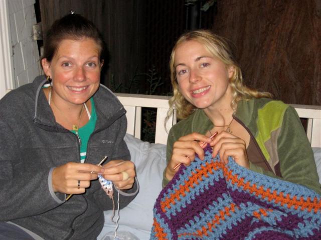 Marie teaching Nicole to crochet