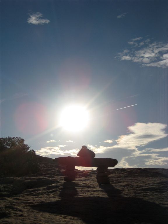 Inukshuk and rising sun