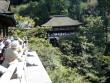 Standing on the temple's large wooden veranda