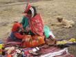 Andean woman selling crafts to trekkers